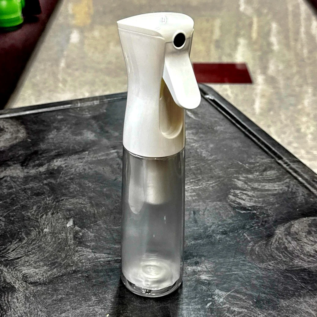 WHITE EZ Mist, a refillable 10oz bottle / sprayer combo that provides an aerosol-type mist without any chemical propellants. - A-Team Window Cleaning