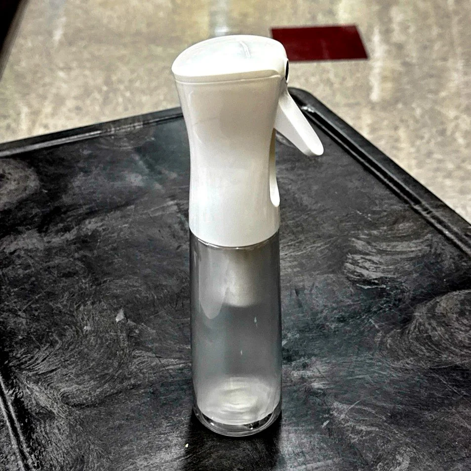 WHITE EZ Mist, a refillable 10oz bottle / sprayer combo that provides an aerosol-type mist without any chemical propellants. - A-Team Window Cleaning